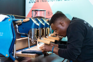 Professional restaurant kitchen team demonstrating equipment at Hostex 40