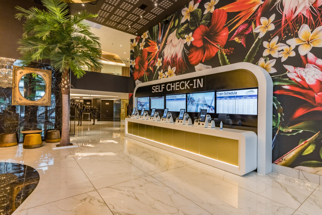 Modern reception area at Hotel Sky Sandton with gold accents and marble finishes