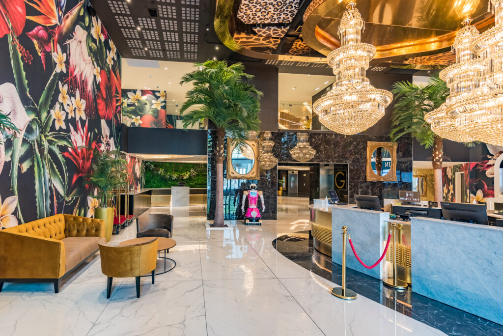 Hotel Sky Sandton luxury lobby with chandeliers and tropical decor
