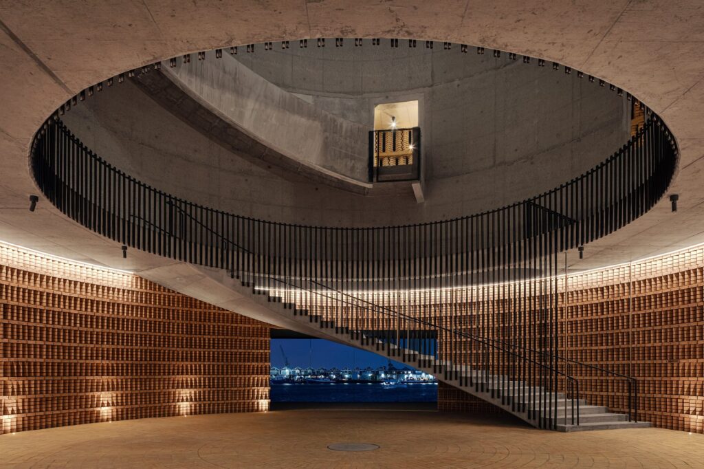 Inside The Drum: a spiral staircase climbs a brick cylinder open to the sky