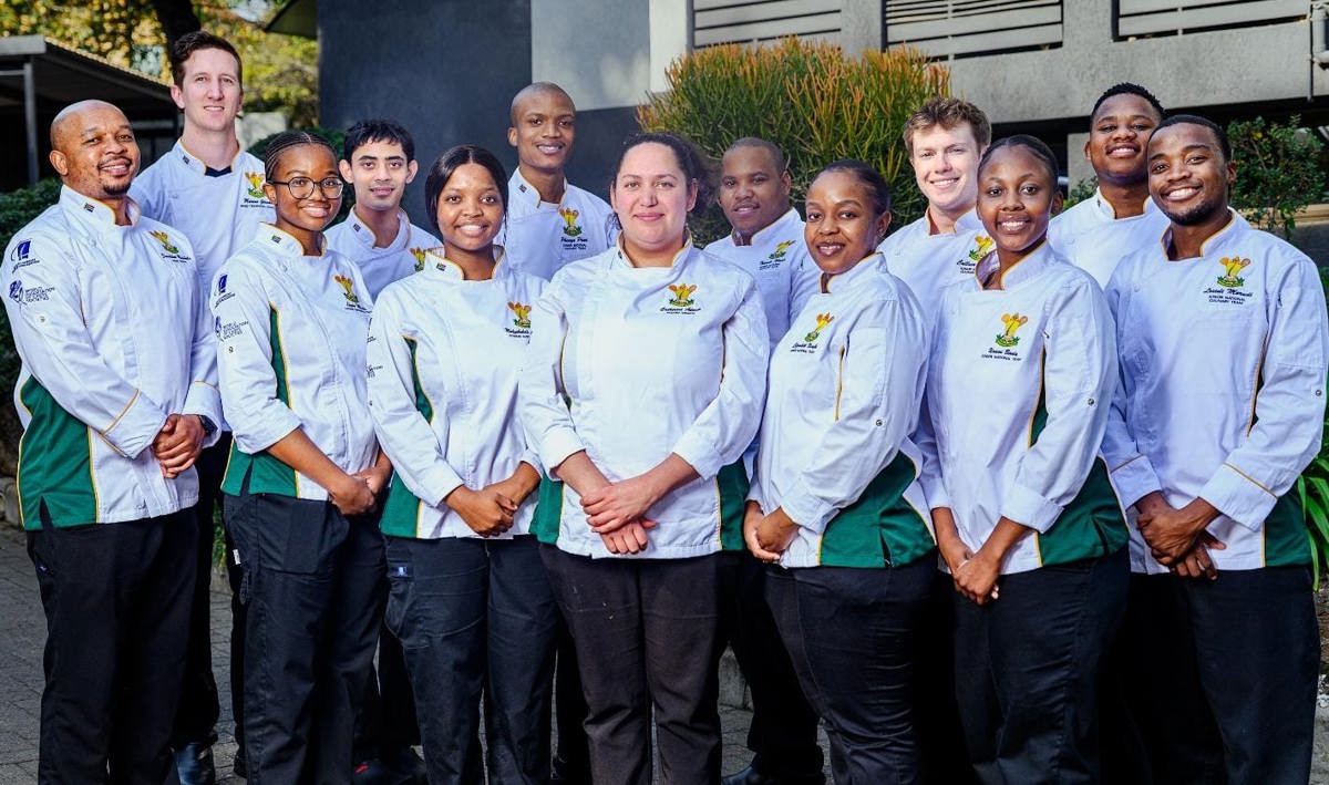 Team Masakhane, South Africa's National Junior Culinary Team, in white chef's jackets with green and gold trim
